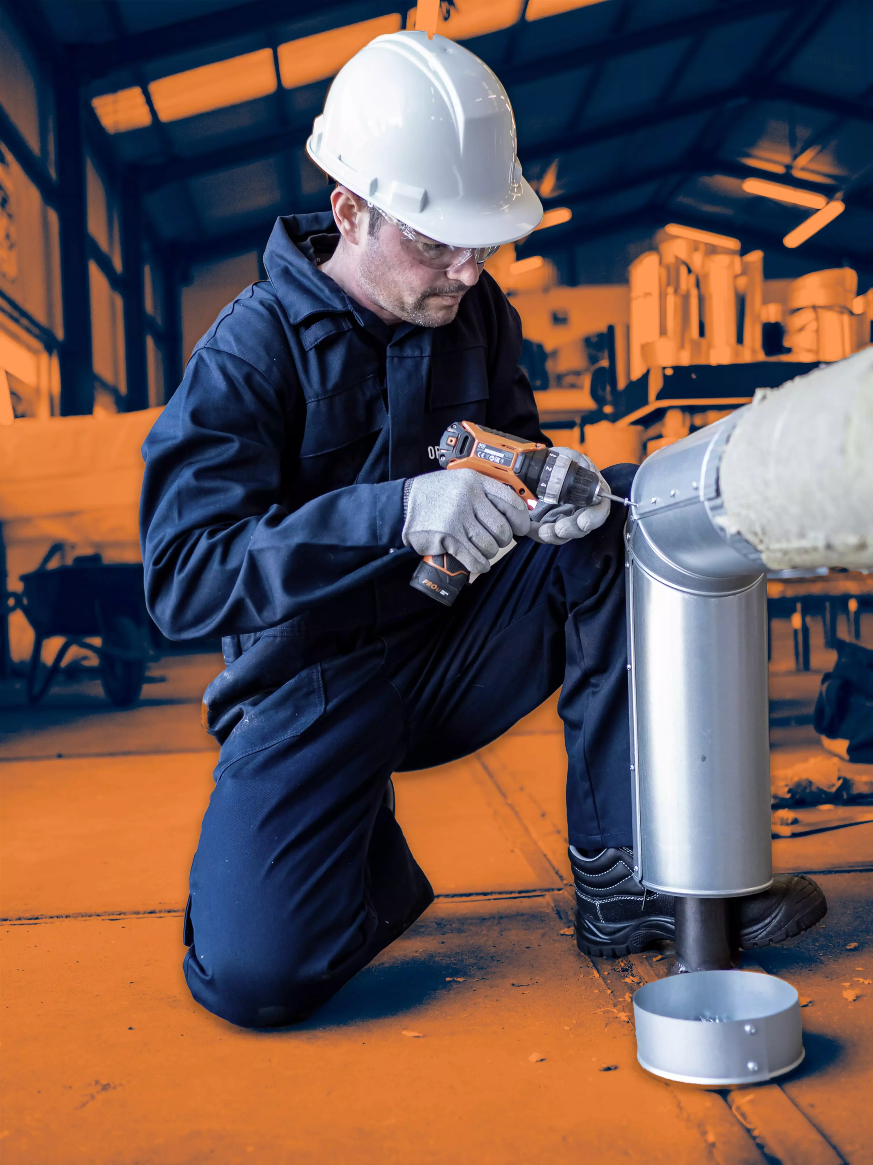 Insulation specialist using a power drill to work on a metal pipe section in an industrial setting.